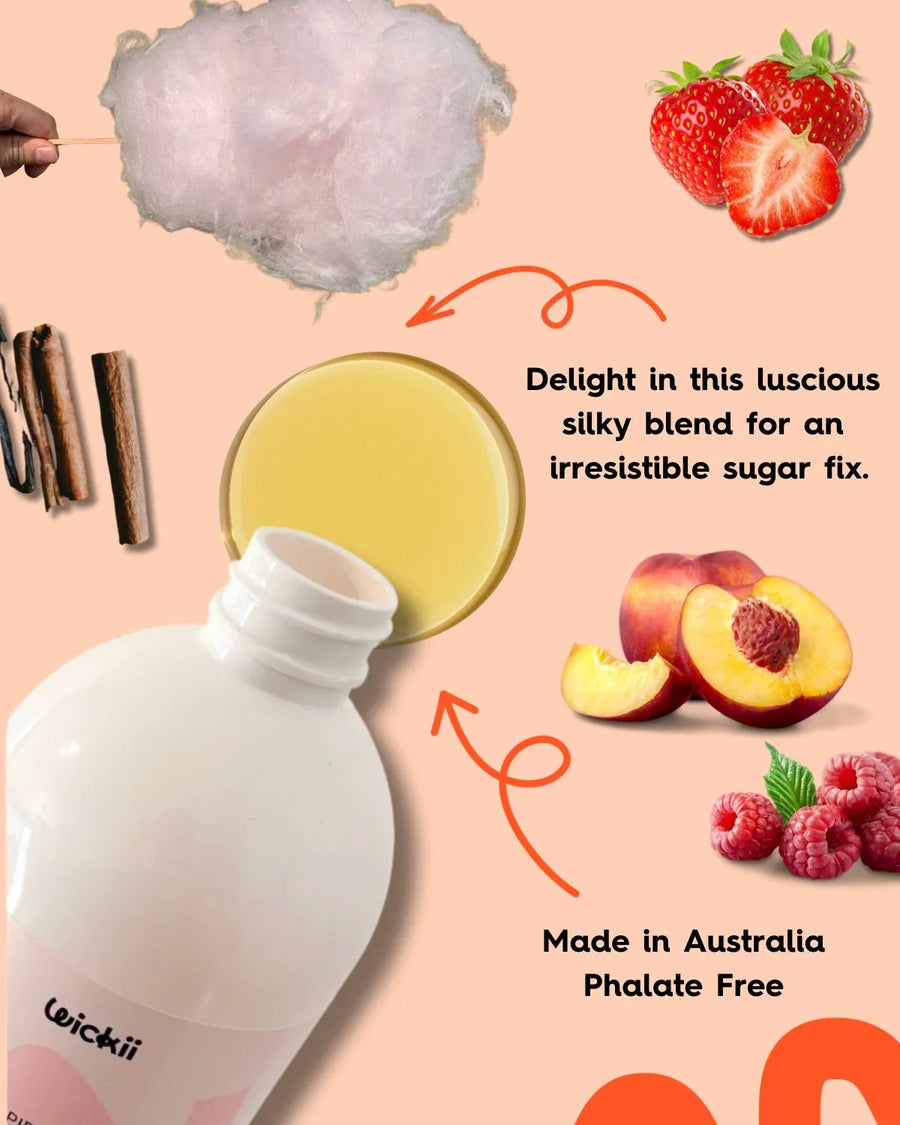 Fragrance oil bottle with cotton candy, strawberries, vanilla, cinnamon, peach, and raspberry.