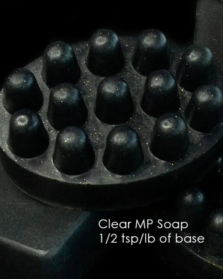 Black massage bar soap with glitter, labeled clear melt and pour soap for soap making.