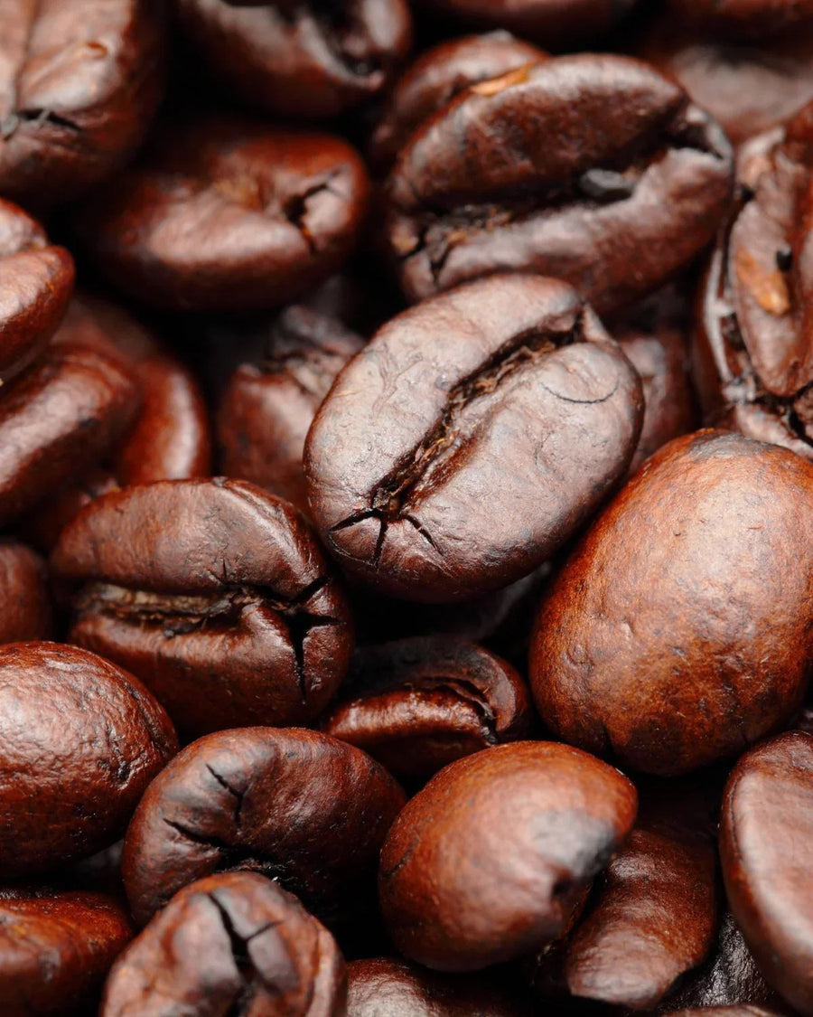 Close-up of roasted coffee beans, rich brown color and detailed texture