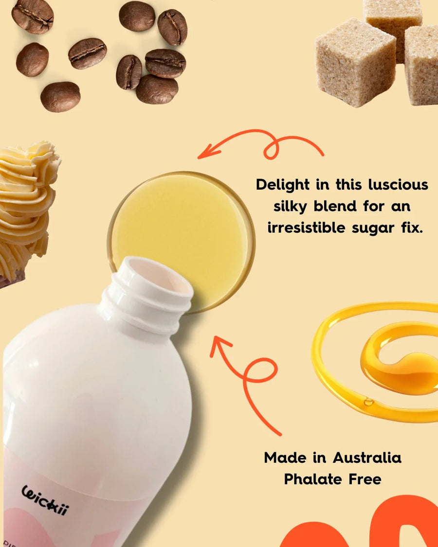 Fragrance oil bottle with creamy yellow liquid, coffee beans, sugar cubes and swirl, candle making supplies.