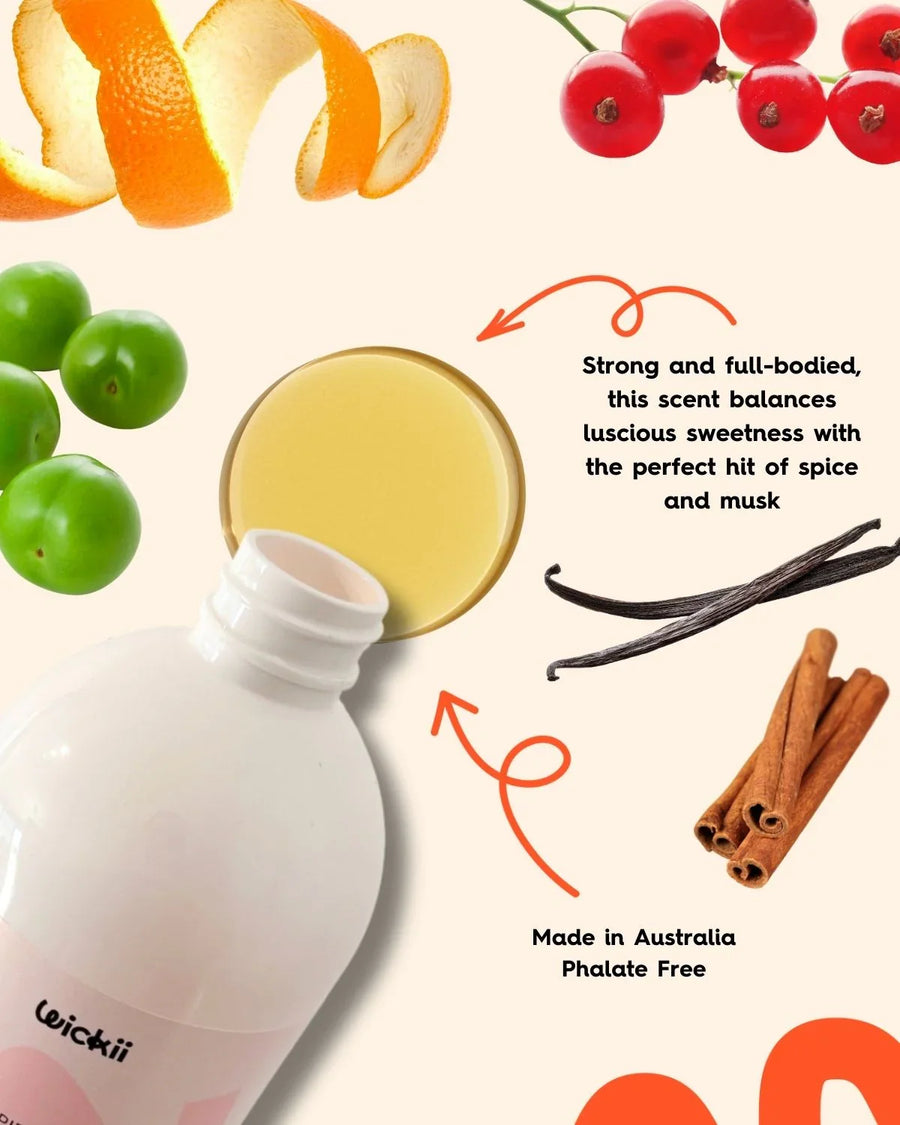 Fragrance oil bottle with orange peel, cherries, green plums, vanilla, and cinnamon, ideal for candle making.