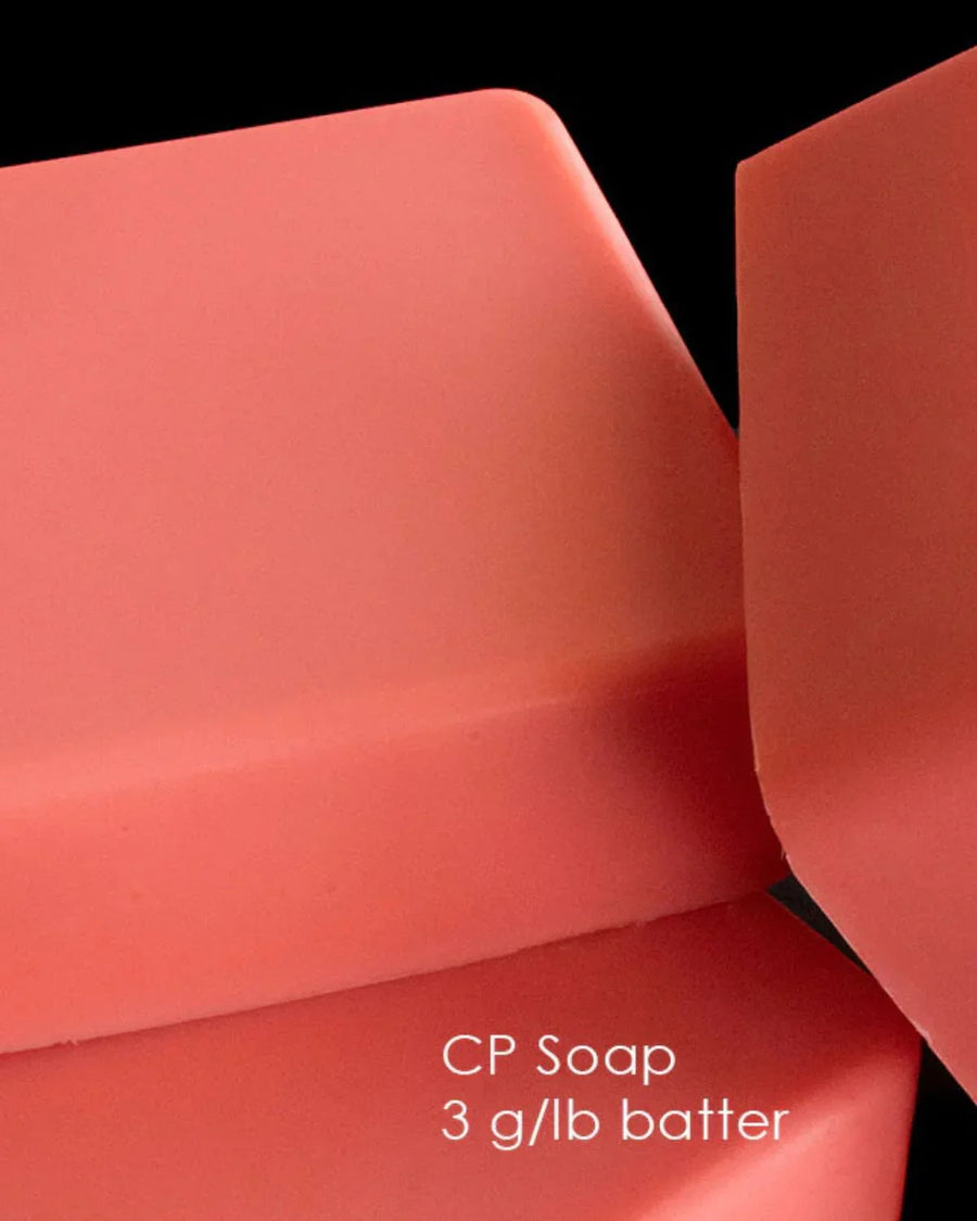 Close-up of smooth pink cold process soap bars, ideal for soap making supplies.