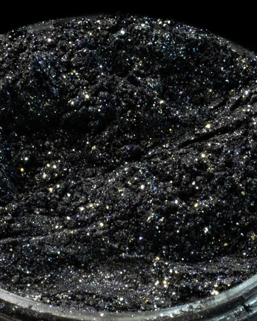 Black glitter pigment powder with sparkling metallic flecks for candle making or crafts