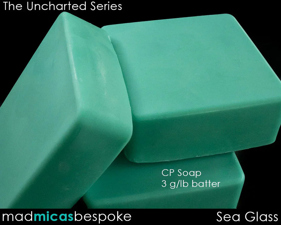 Sea glass green cold process soap bars with smooth finish on black background
