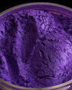 Vibrant purple mica powder in a clear jar for candle or soap making supplies