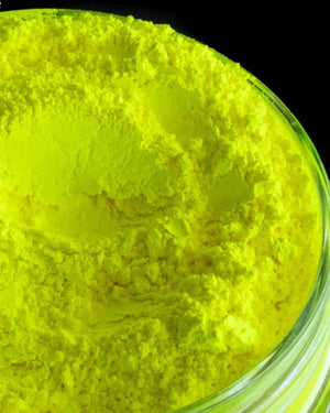 Bright yellow mica powder in a clear jar for candle or soap making supplies