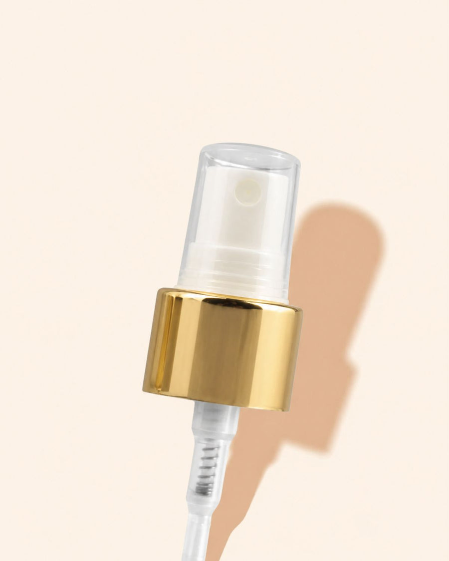 white atomiser with gold cap