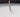 Close-up of a cotton candle wick set in creamy white candle wax