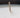 Close-up of a cotton candle wick set in creamy white candle wax