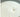 Close-up of a white soy wax candle with wick in clear glass jar, candle making supply