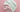Two-tone white and pink whipped soap base on a pink background, smooth texture