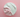 Two-tone white and pink whipped soap base on a pink background, smooth texture