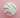 Two-tone white and pink whipped soap base on a pink background, smooth texture