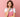 Woman in pink apron thinking, candle making supplies concept, pink background
