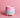 Ceramic wax melt warmer with pink and blue gradient on a pink background