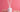 White reed diffuser bottle with reeds and dried flowers on pink background