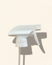 white 28/410 trigger spray nozzle for bottles on a neutral background