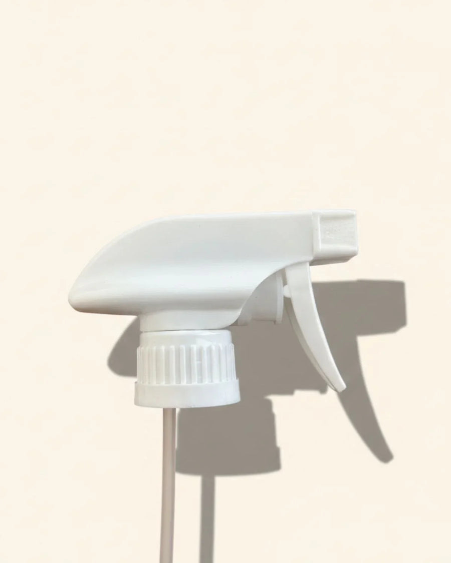 white 28/410 trigger spray nozzle for bottles on a neutral background