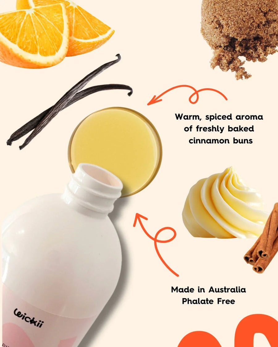 Fragrance oil bottle with vanilla, orange slices, brown sugar, cinnamon, and butter, warm cinnamon bun scent.