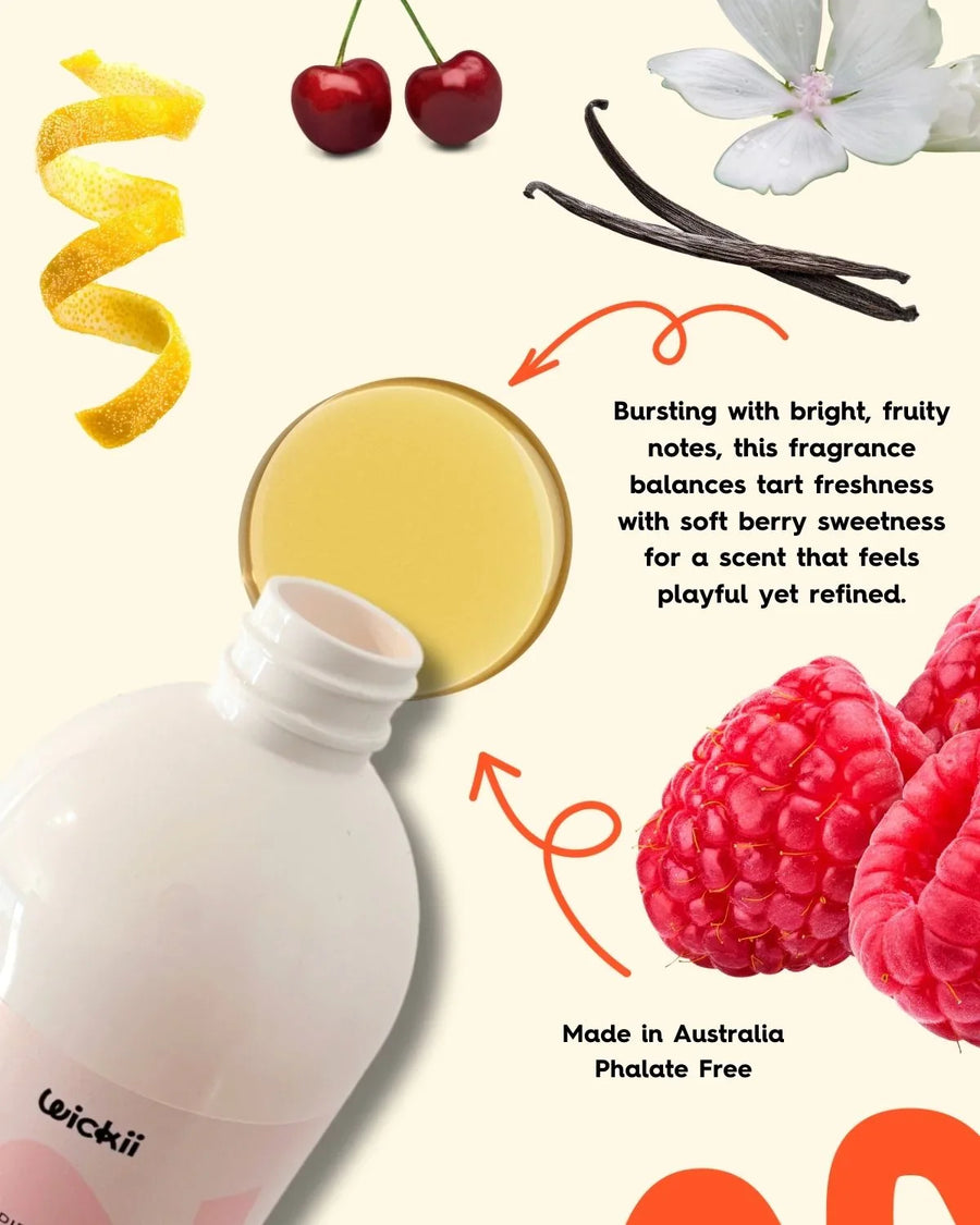 Fragrance oil bottle with raspberries, cherries, vanilla, citrus peel, and floral accents