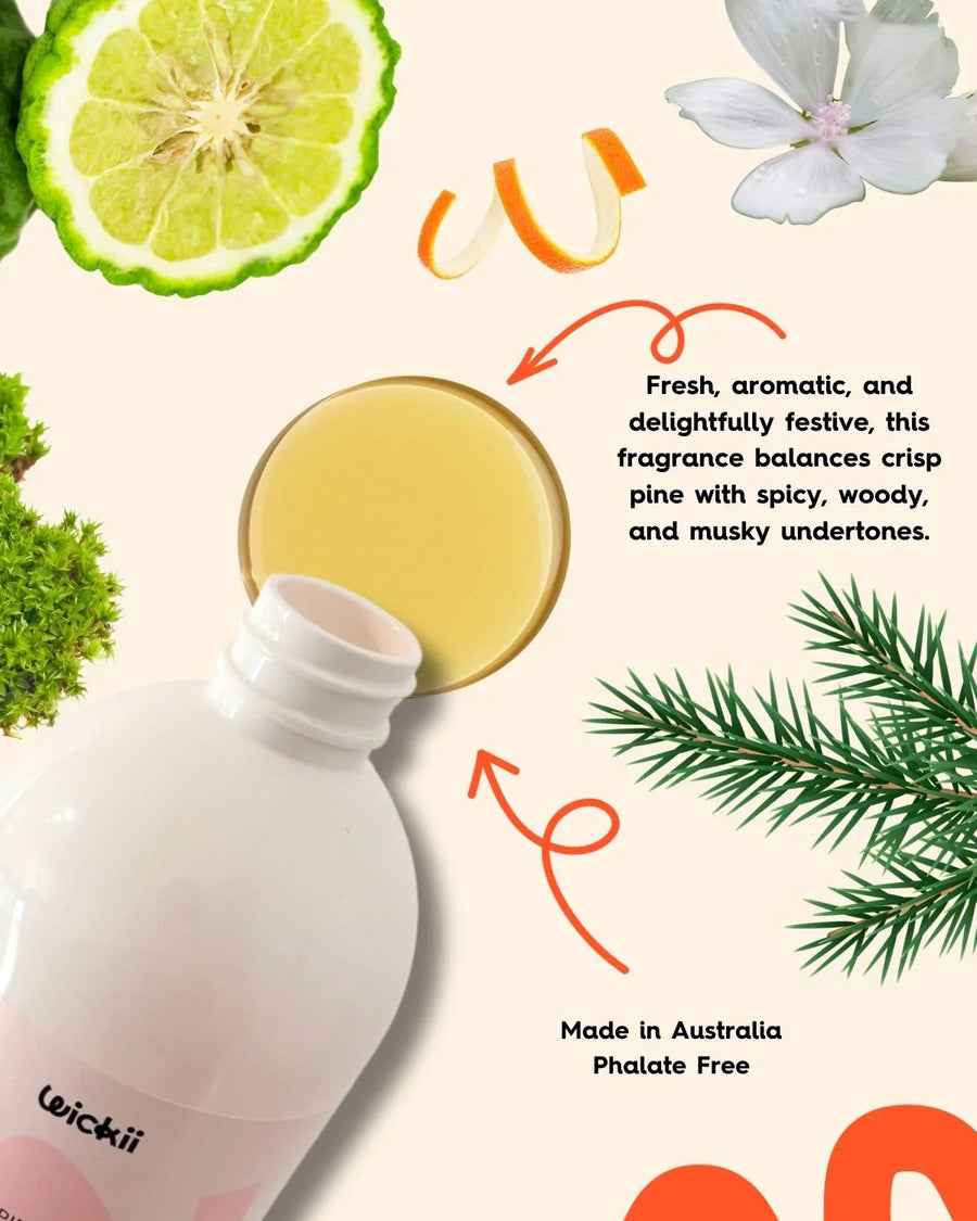 Fragrance oil bottle with fresh citrus, pine, and floral elements for candle making.
