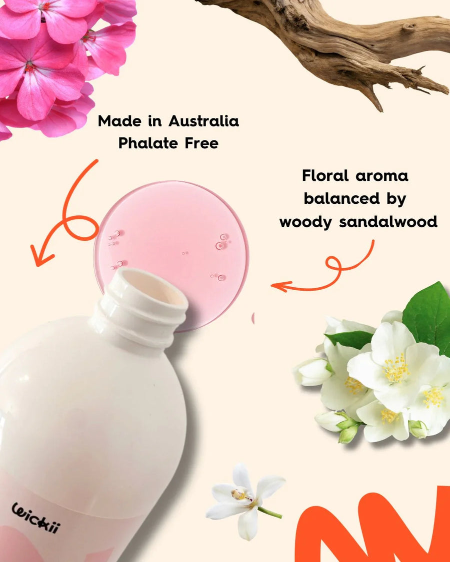Pink fragrance oil bottle with floral jasmine, woody sandalwood, and Made in Australia text