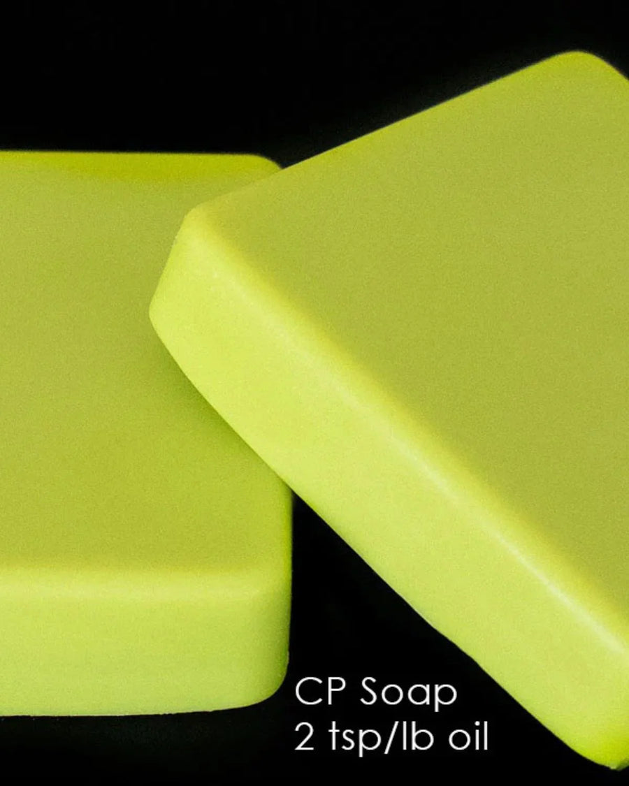 Two yellow cold process soap bars on a black background, text reads CP Soap 2 tsp/lb oil.