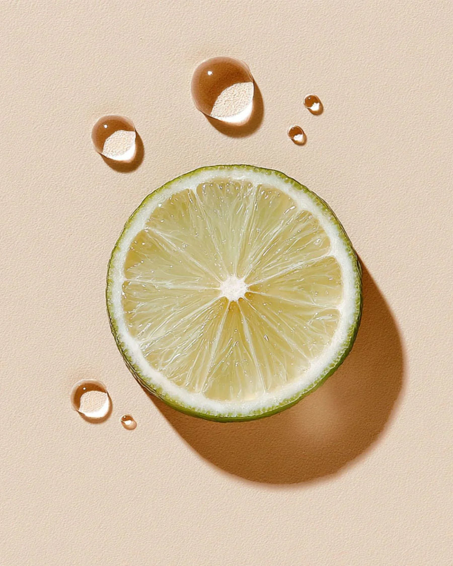 Fresh bergamot slice with water droplets on light background, fragrance oil concept