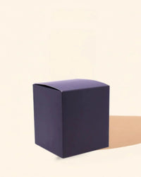 Matte black candle box for packaging, displayed on a neutral background