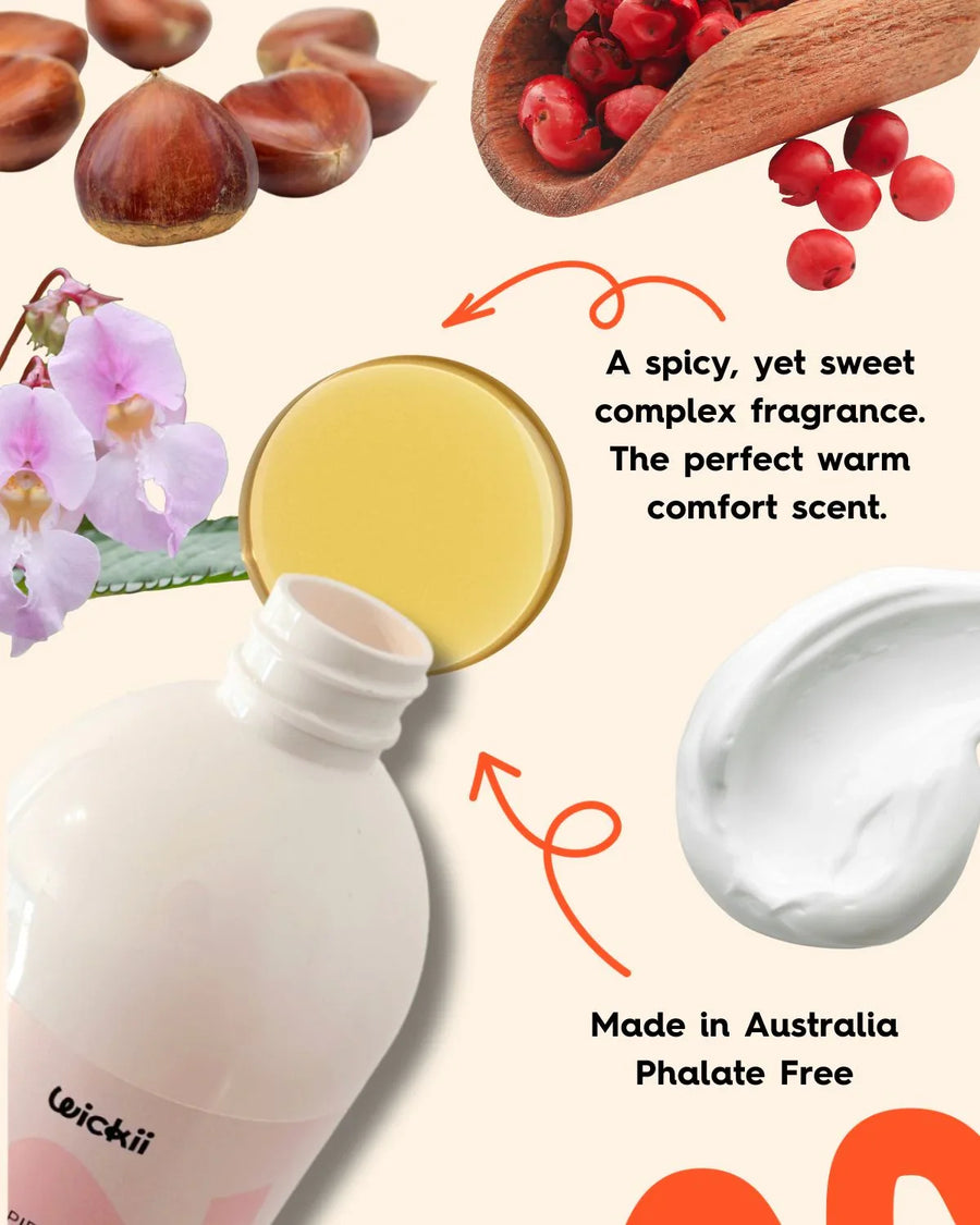 Fragrance oil bottle with liquid, chestnuts, pink peppercorns, orchid, and creamy wax texture.