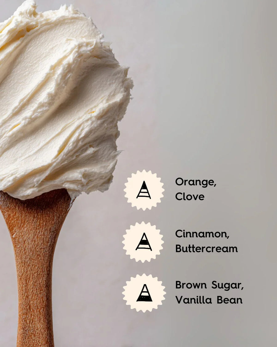 Wooden spoon with creamy buttercream, scent notes of orange, clove, cinnamon, brown sugar, vanilla.