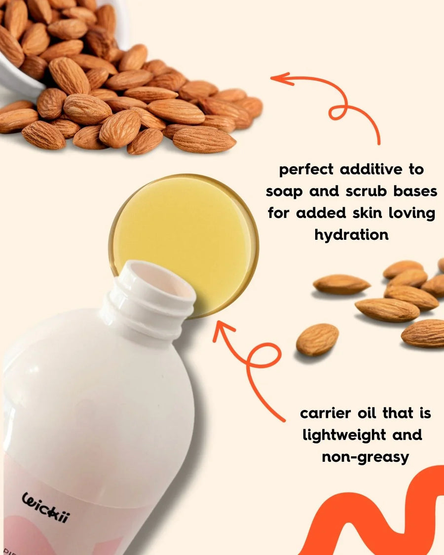 Almond carrier oil bottle, golden oil, raw almonds, used for hydrating soap and scrub bases.