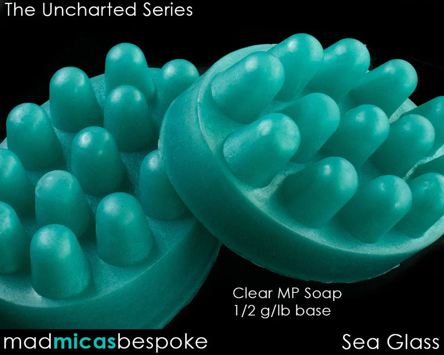 Aqua blue sea glass massage soap bars with raised nodules, clear melt and pour base.