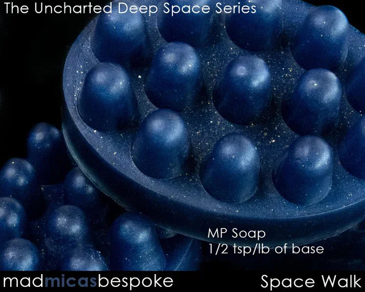 Blue mica-infused massage soap bars with raised nodules, sparkly deep space effect.