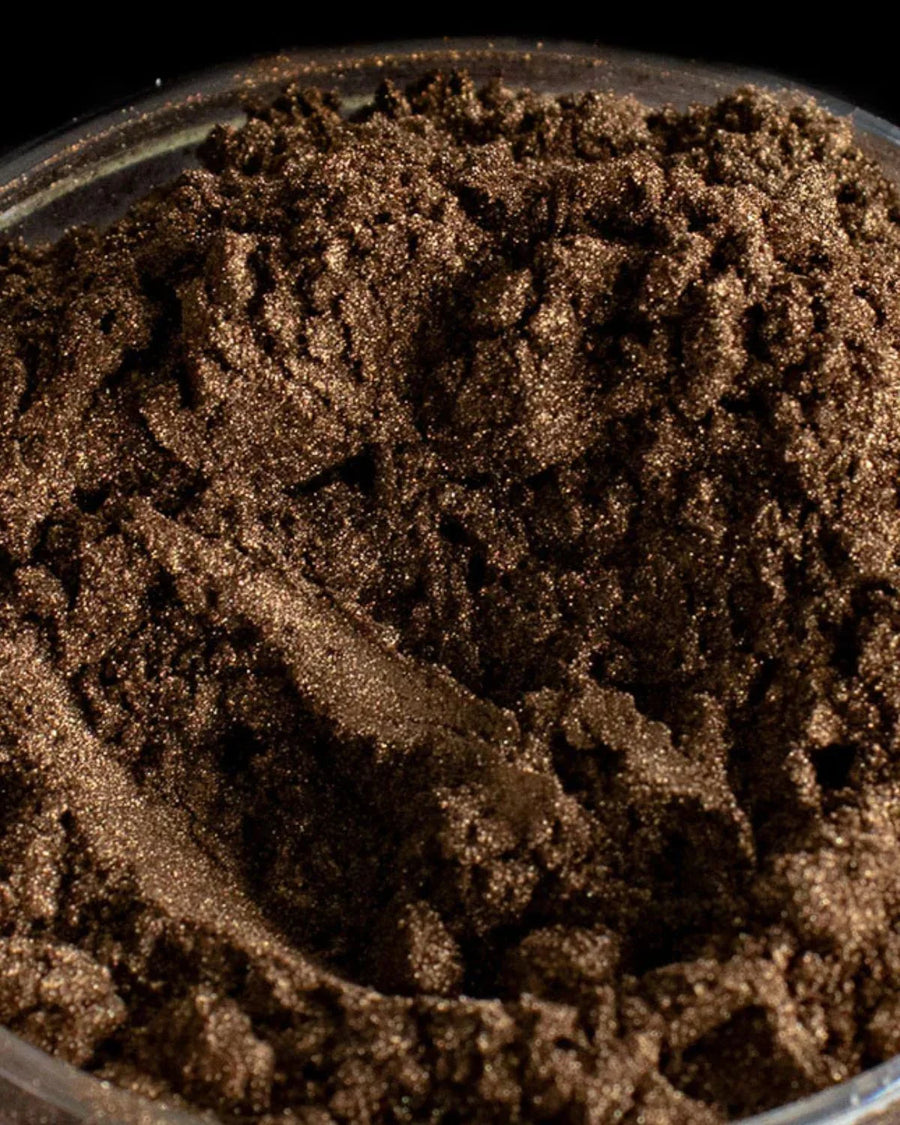 Close-up of bronze mica powder pigment for candle and soap making supplies