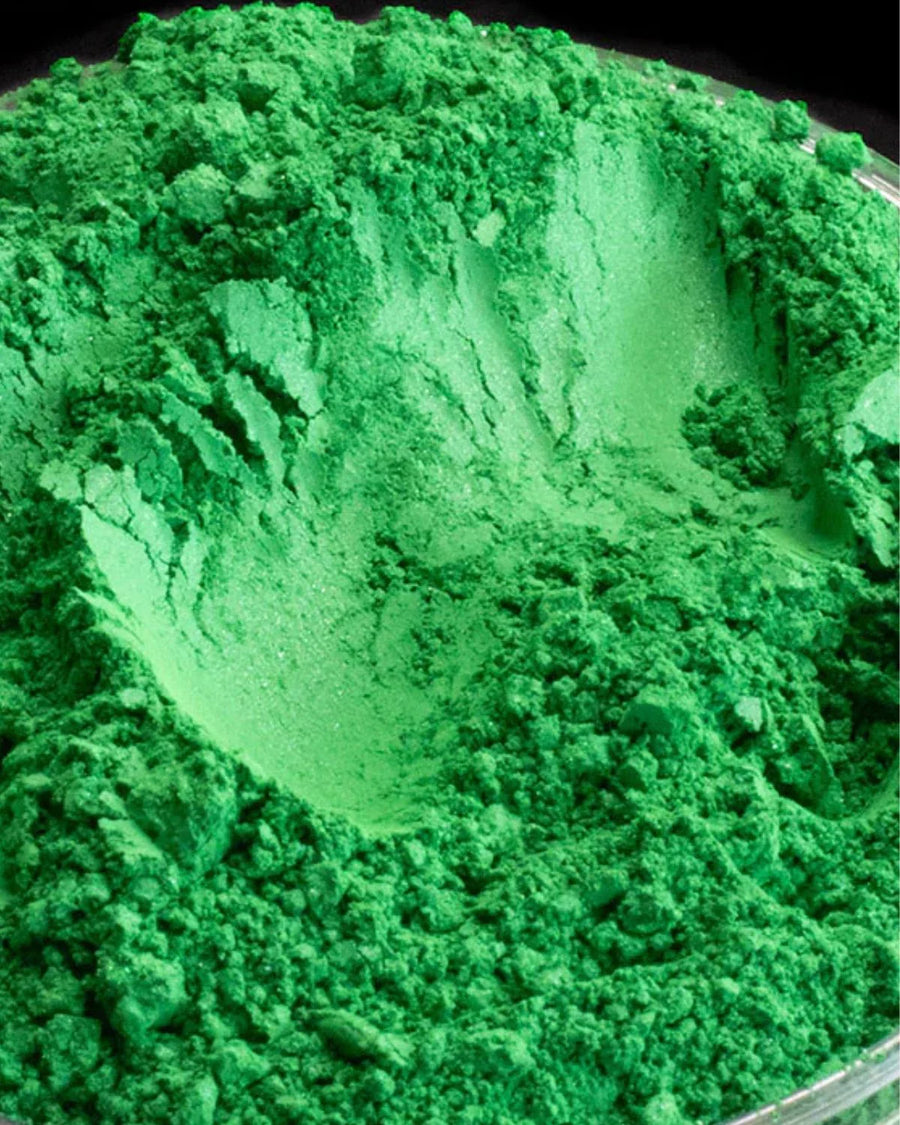Bright green mica powder pigment for candle making, soap, and DIY crafts in a close-up view.
