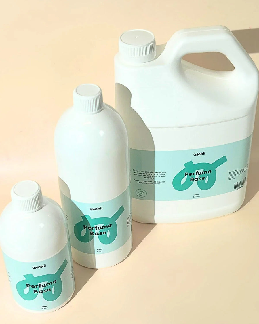 Three bottles of Wickii perfume base in various sizes for candle and fragrance making.