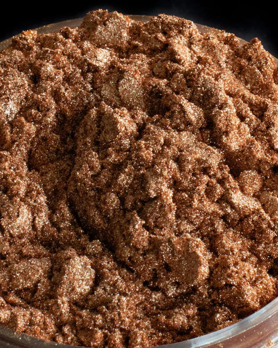 Close-up of bronze mica powder, ideal for candle making and soap crafting projects.