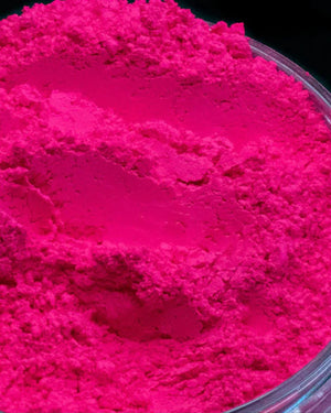 Bright pink candle making mica powder in a clear container, perfect for soap and crafts