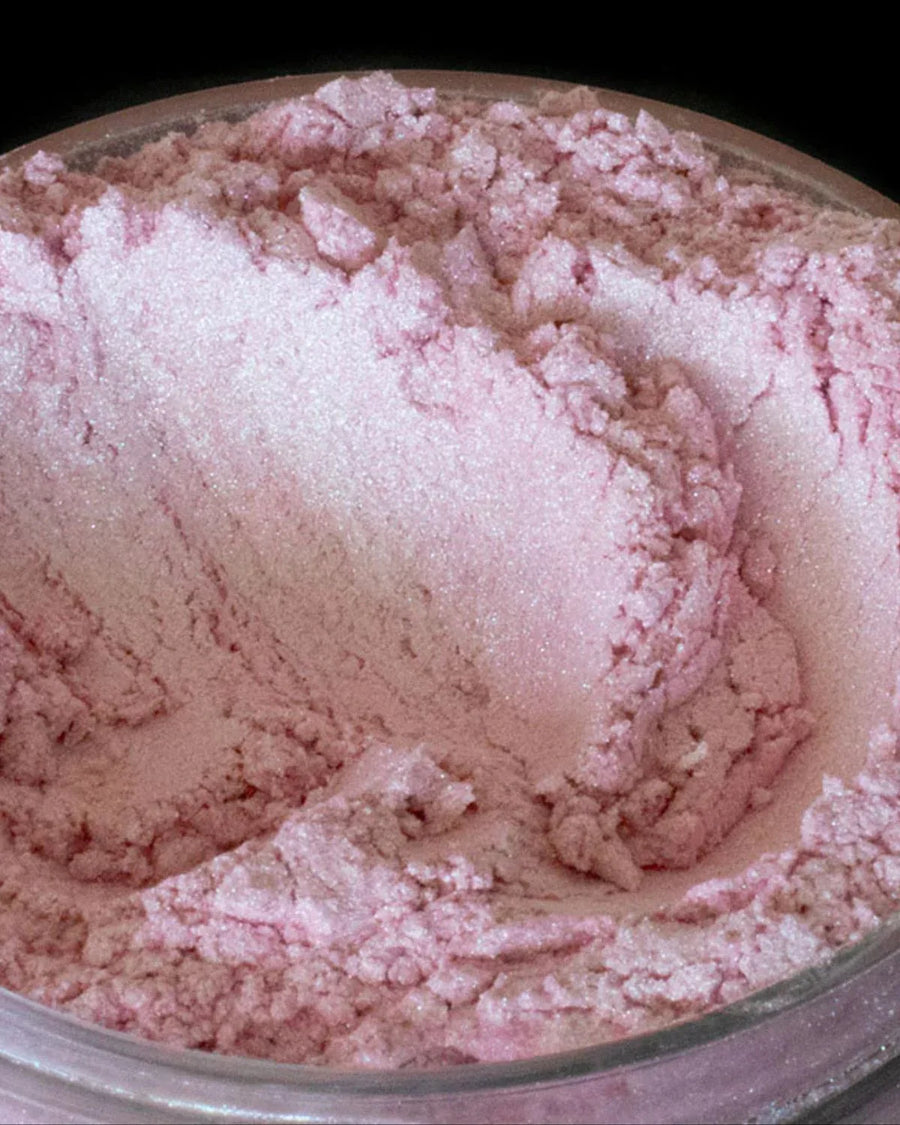 Close-up of pink mica powder for candle or soap making in a clear jar