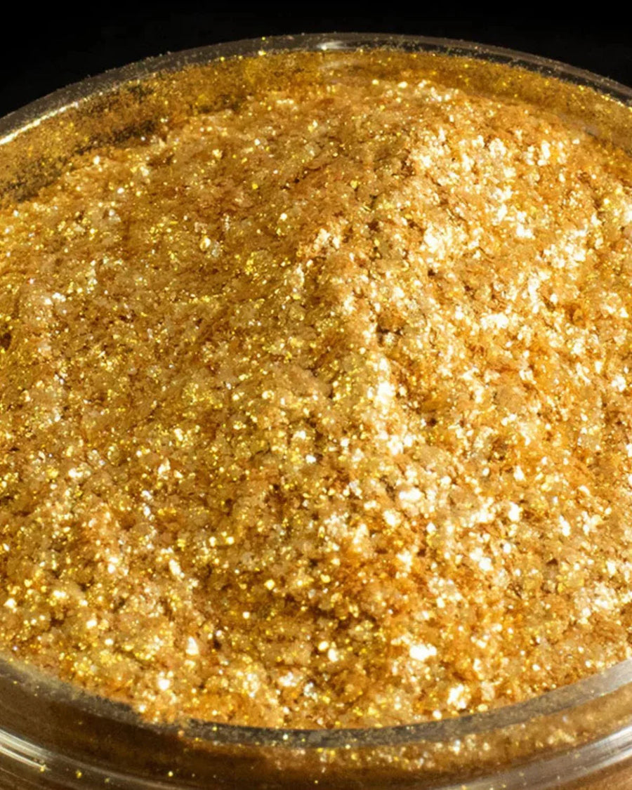 Close-up of gold mica powder pigment for candle making and soap crafting supplies