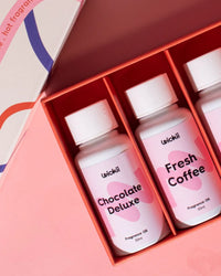 Boxed set of Wickii fragrance oils for candle making, featuring Chocolate Deluxe and Fresh Coffee scents.