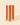 Three wooden candle wicks with metal tabs standing upright on a beige background